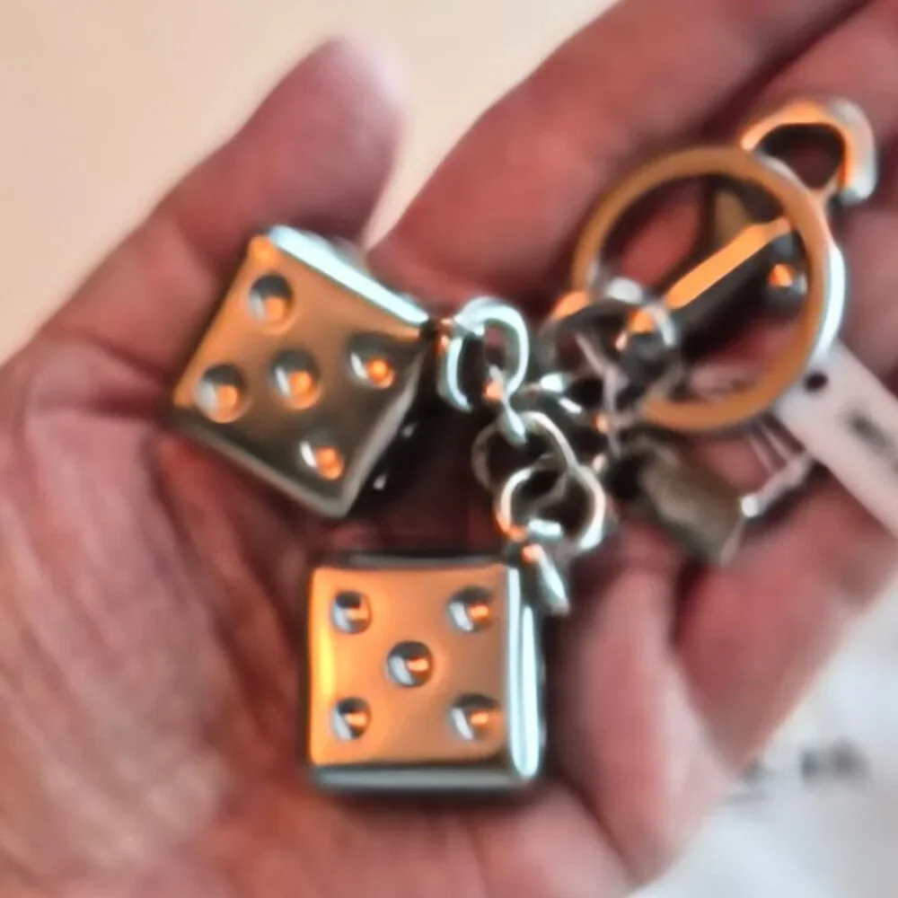 Coach Dice Bag Charm #CZ128 purchase comes with Coach dust bag